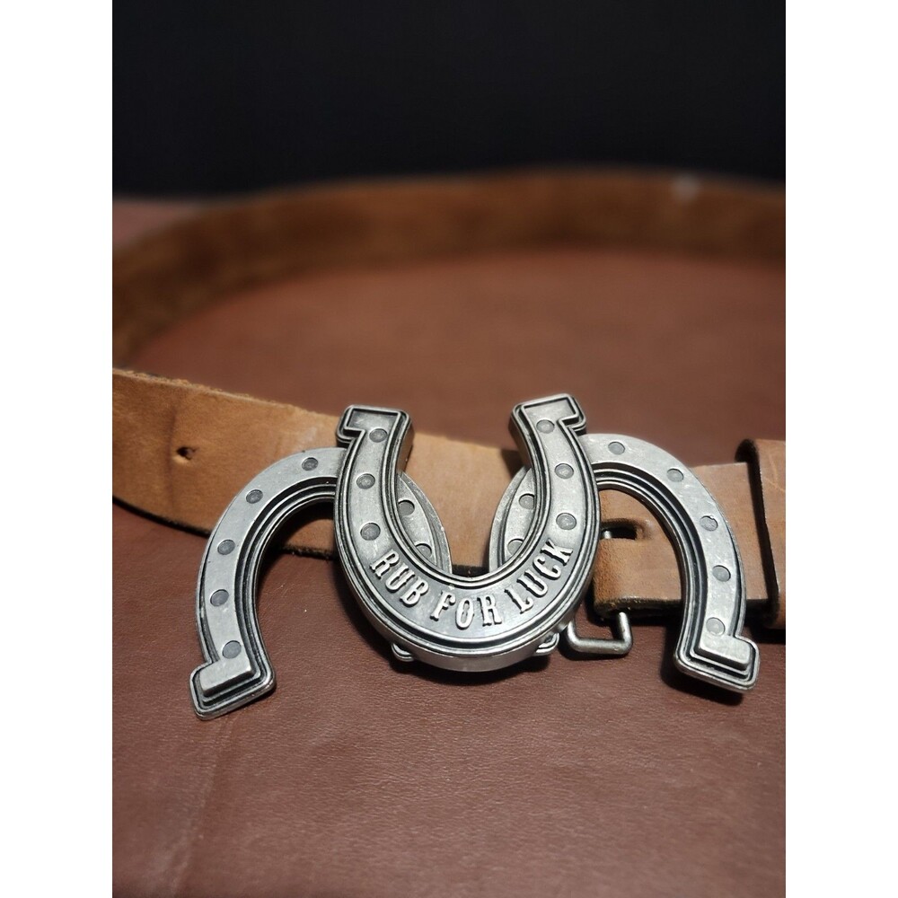 This Justin brand belt is made from top grain cowhide in the USA.